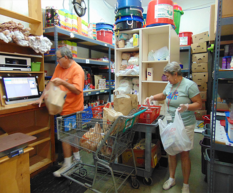 Volunteers loading shopping bags