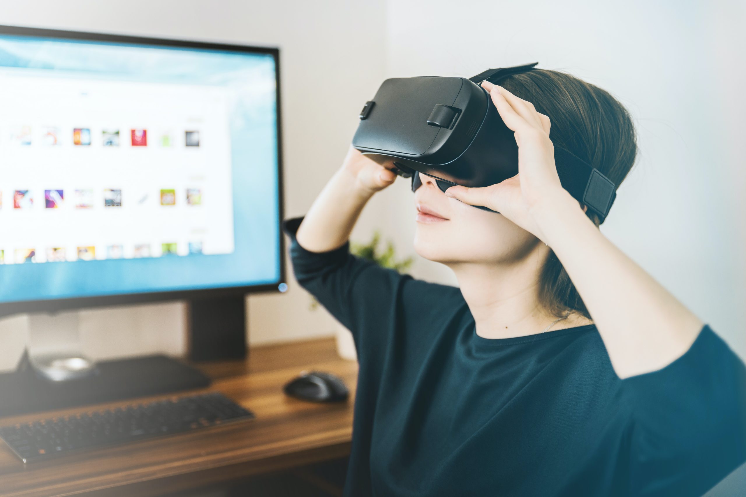 an image of a person using a virtual reality headset.
