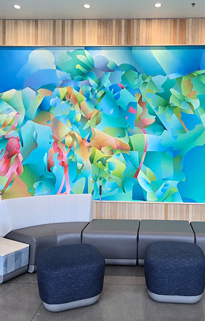 Photo of abstract mural displayed in a lounge area