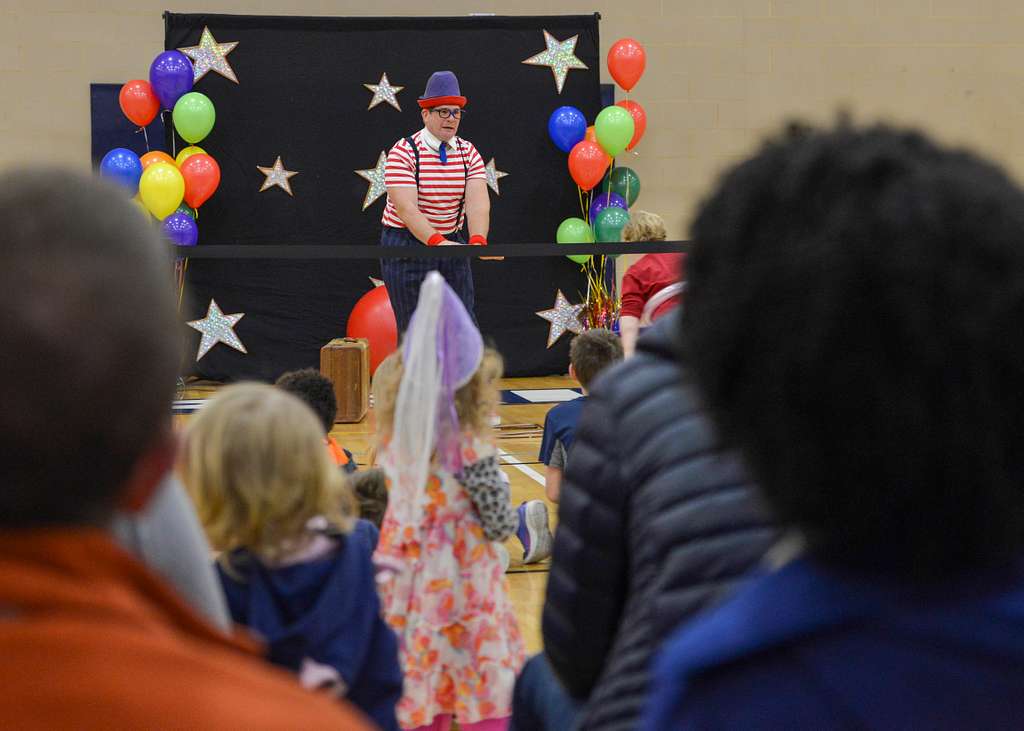 Kids watching a magic show performance