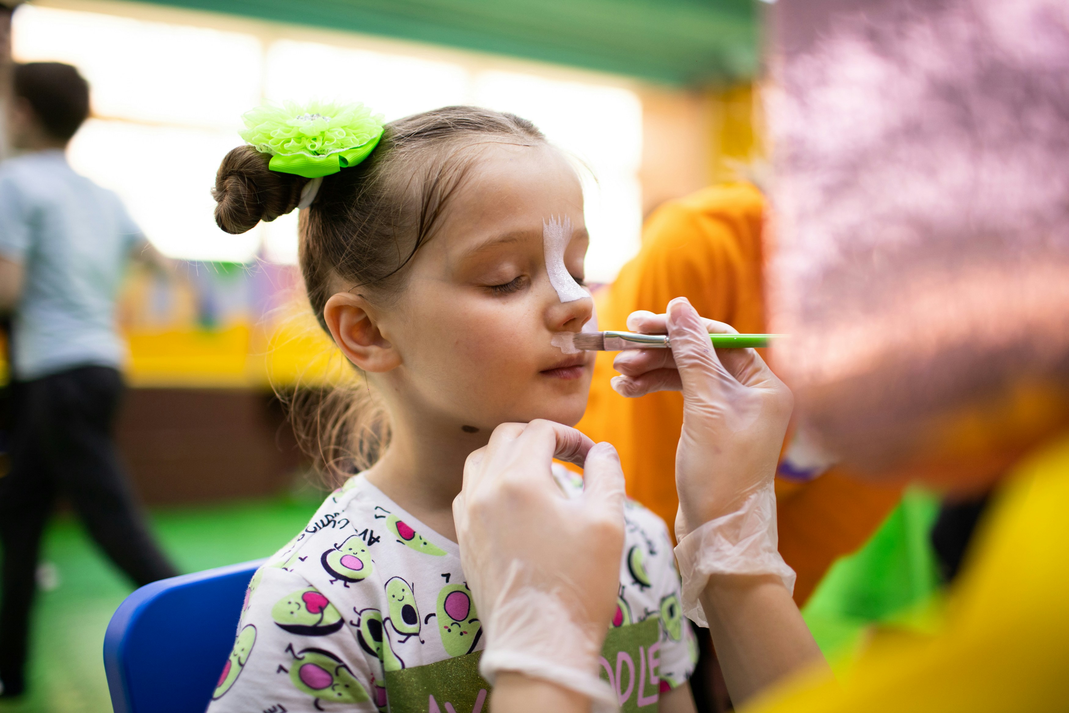 girl having her face painted