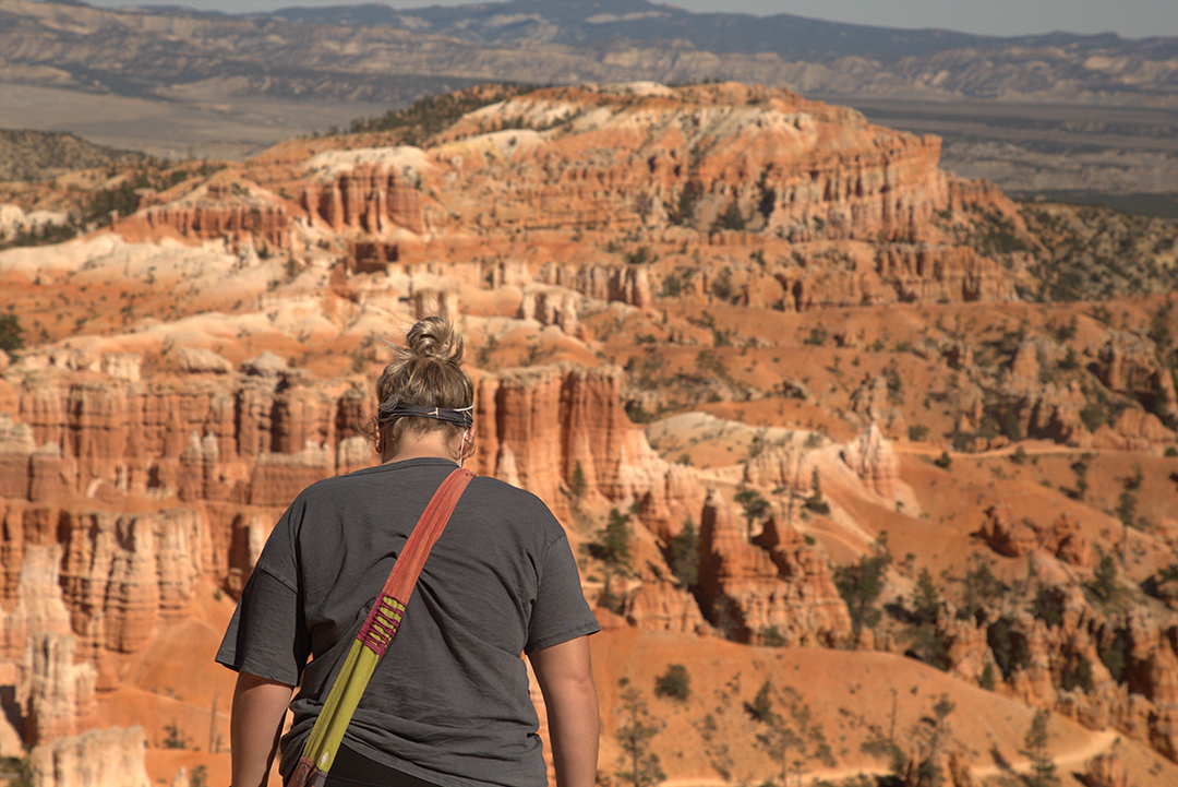 A girl standing looking out into Bryce Canyon.