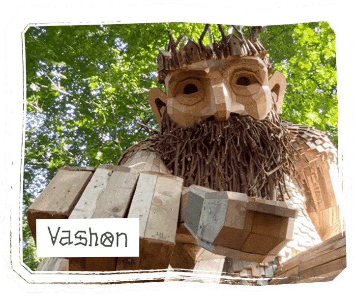 Oscar the Bird King, a wooden troll sculpture by Thomas Dambo, positioned majestically in a natural setting with elements reflecting its bird-inspired theme, symbolizing freedom and the beauty of wildlife, made from recycled materials.