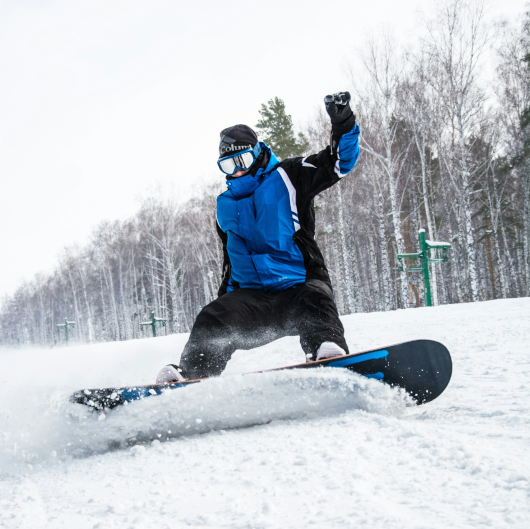 snowboarder carving snow