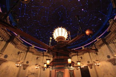 ceiling covered in stars and model of the solar system