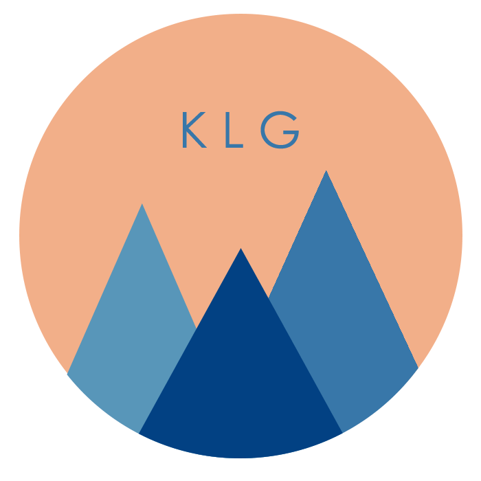 Circle Logo with triangle mountains and KLG