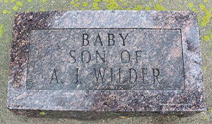 Actual headstone for their son that reads: 'Baby Son of A. J. Wilder'.