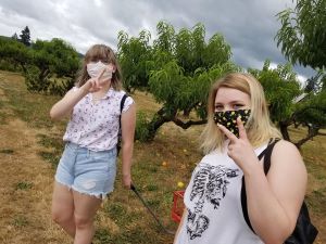 A photo of Kylie and her sister on a farm.