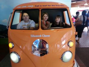 A photo of Austin, Katie, and Kylie in a Tillamook Cheese van.