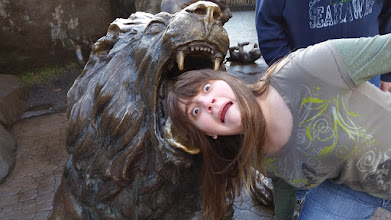 A photo of Kylie being 'eaten' by a lion statue.