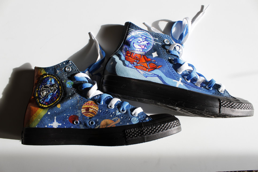 Acrylic shoes painted by Nicole Davis with outerspace and dog in spacesuit published in the 2019 Salal Magazine