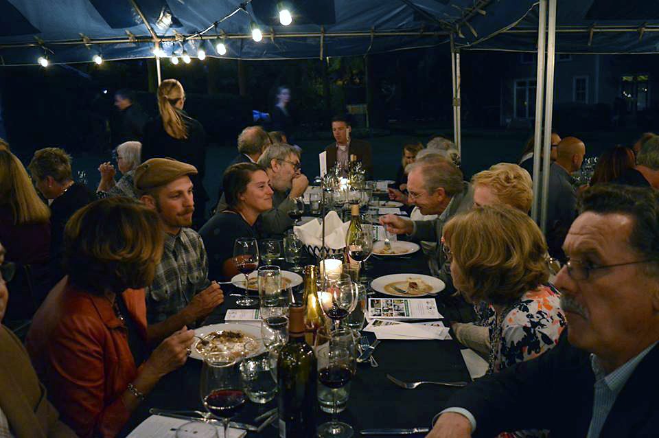 Guests seated at a table eating their dinner.