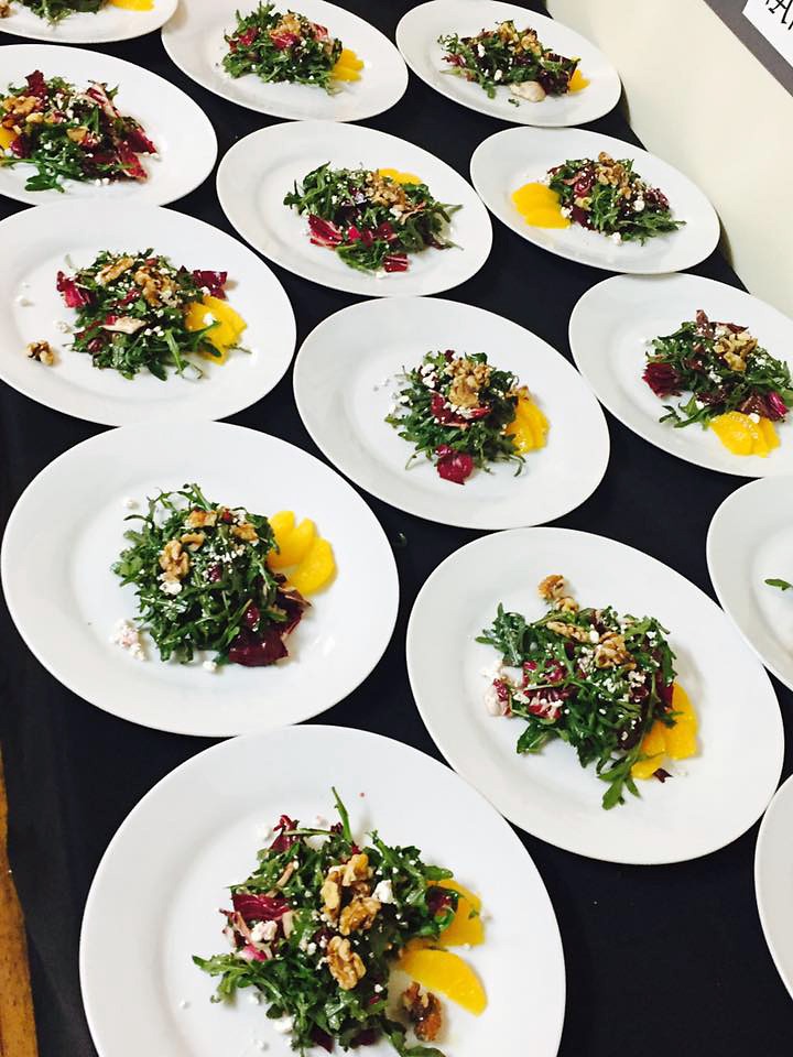 Plates of salad ready to be served.