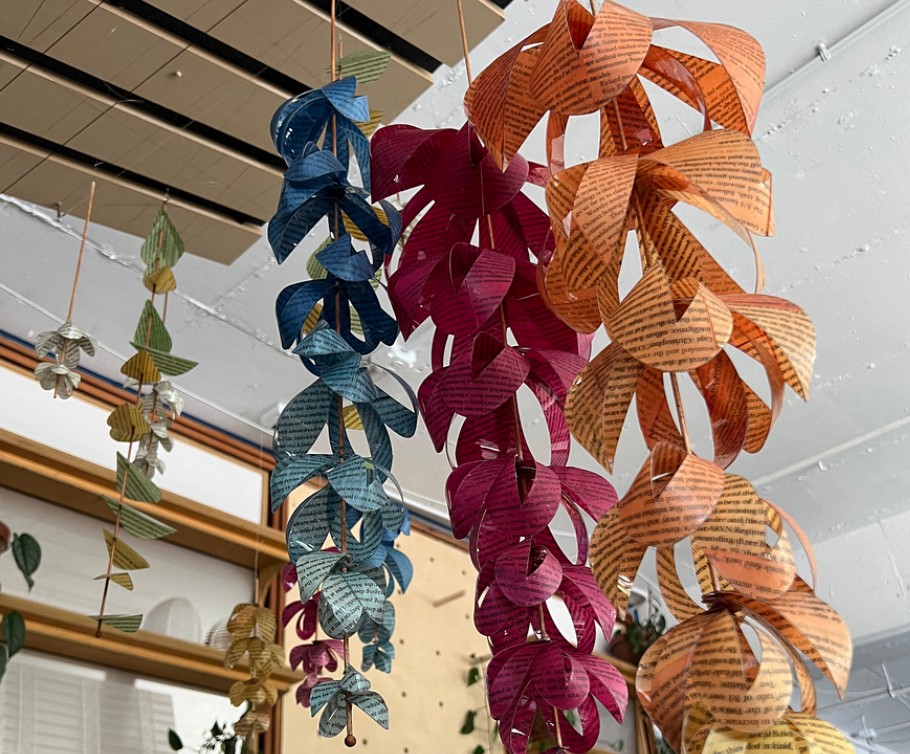 Stems of multicolor flowers made from book pages covered in Dura-Lar