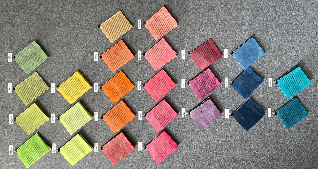 Swatches of book pages in multiple colors