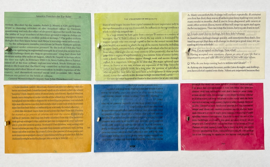 Six book pages dyed in different colors