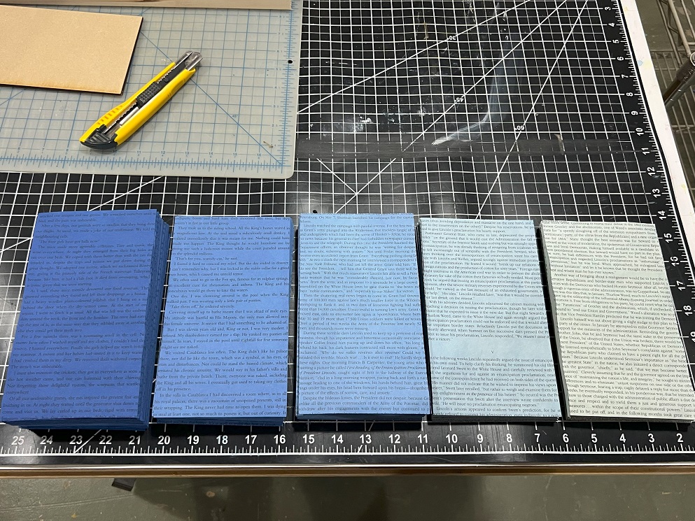 Book pages in a variety of purple blue