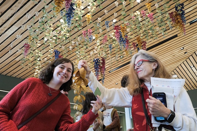 WSUV team visiting Phonic Bloom sculpture at Woodland Community Library