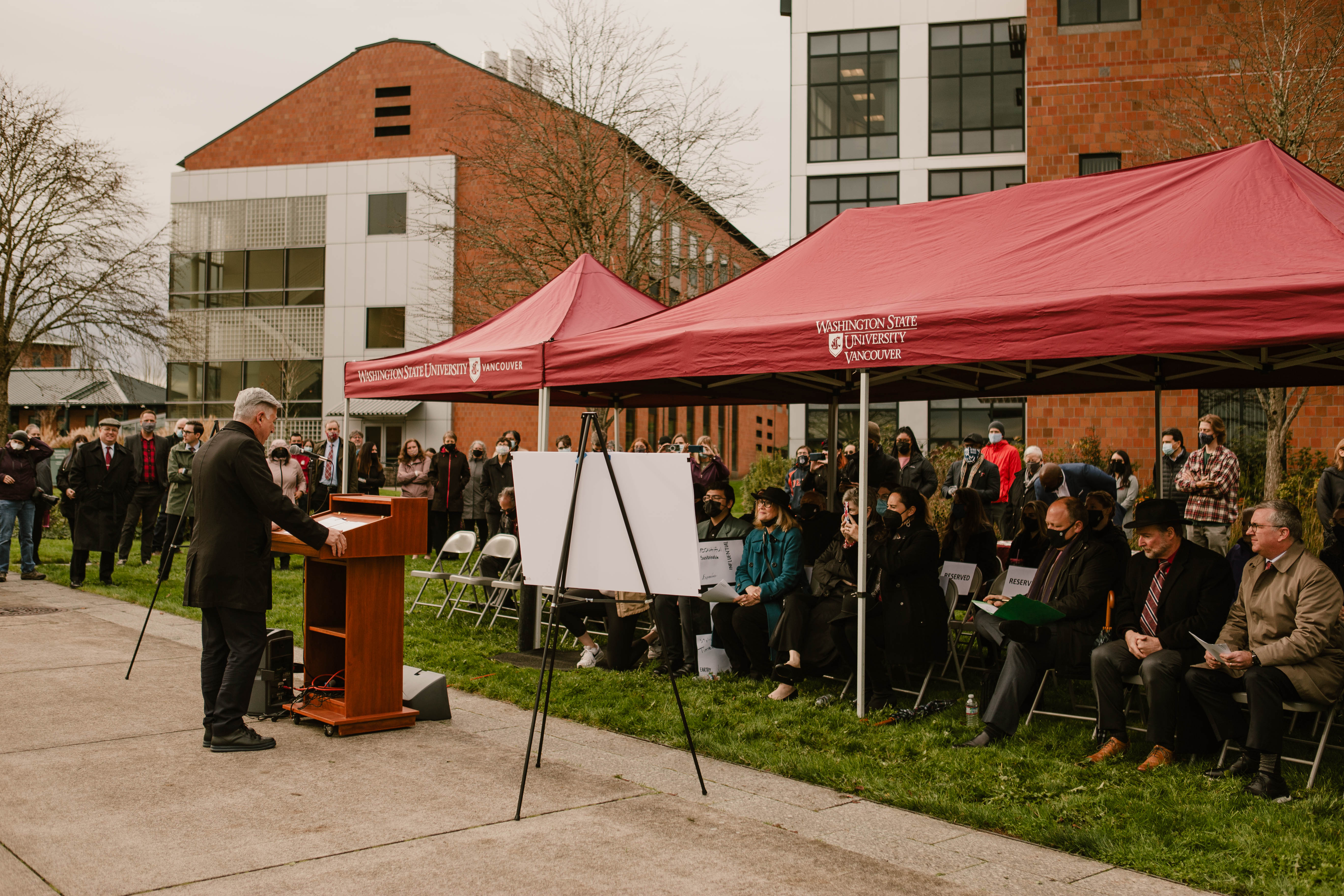 Chancellor speaking to group of people