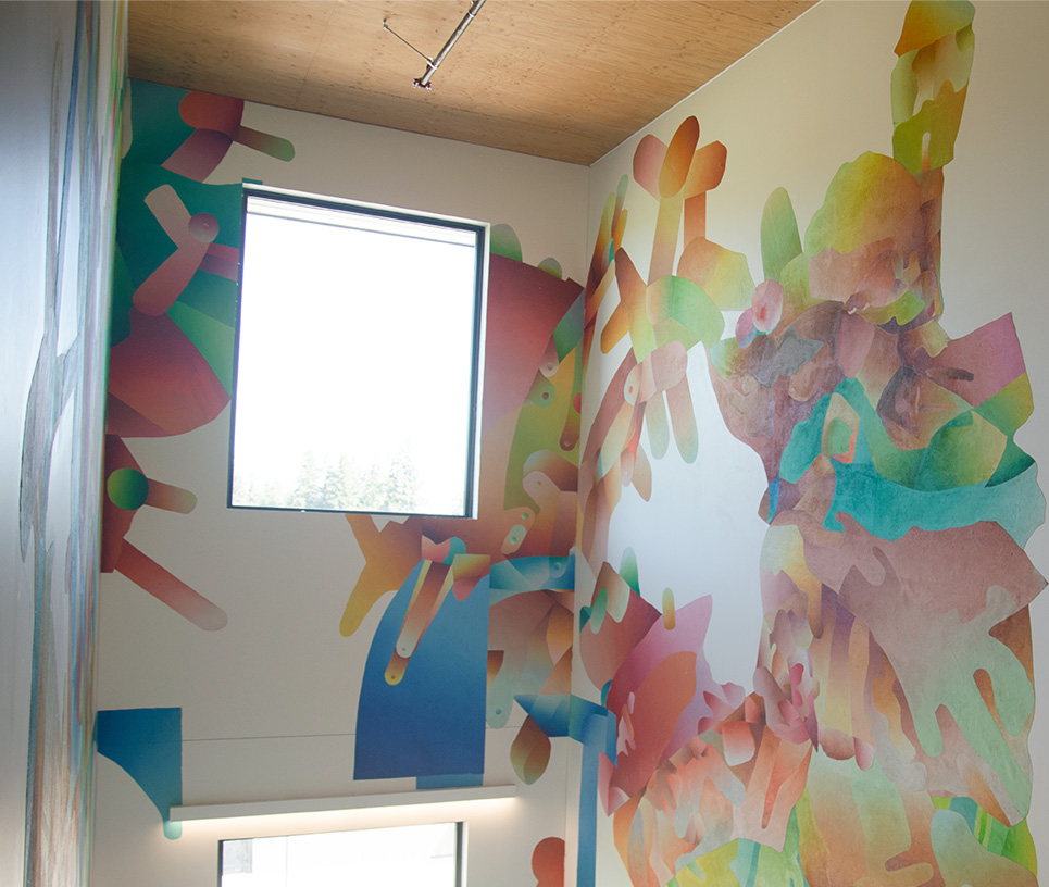 Bright, geometric mural with pastel shapes around a window in a stairwell, by Roberto Delgado