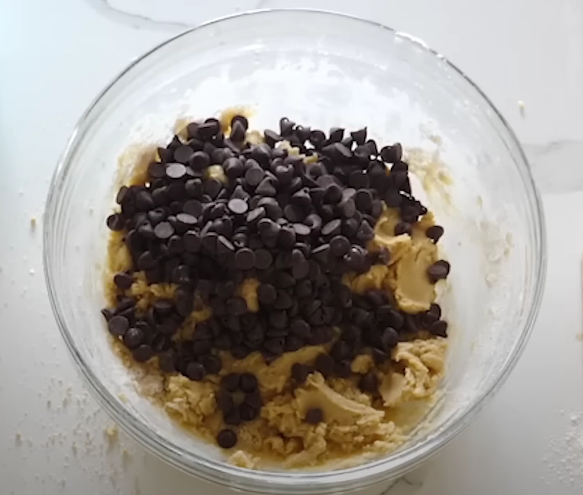 Folding chocolate chips into dough