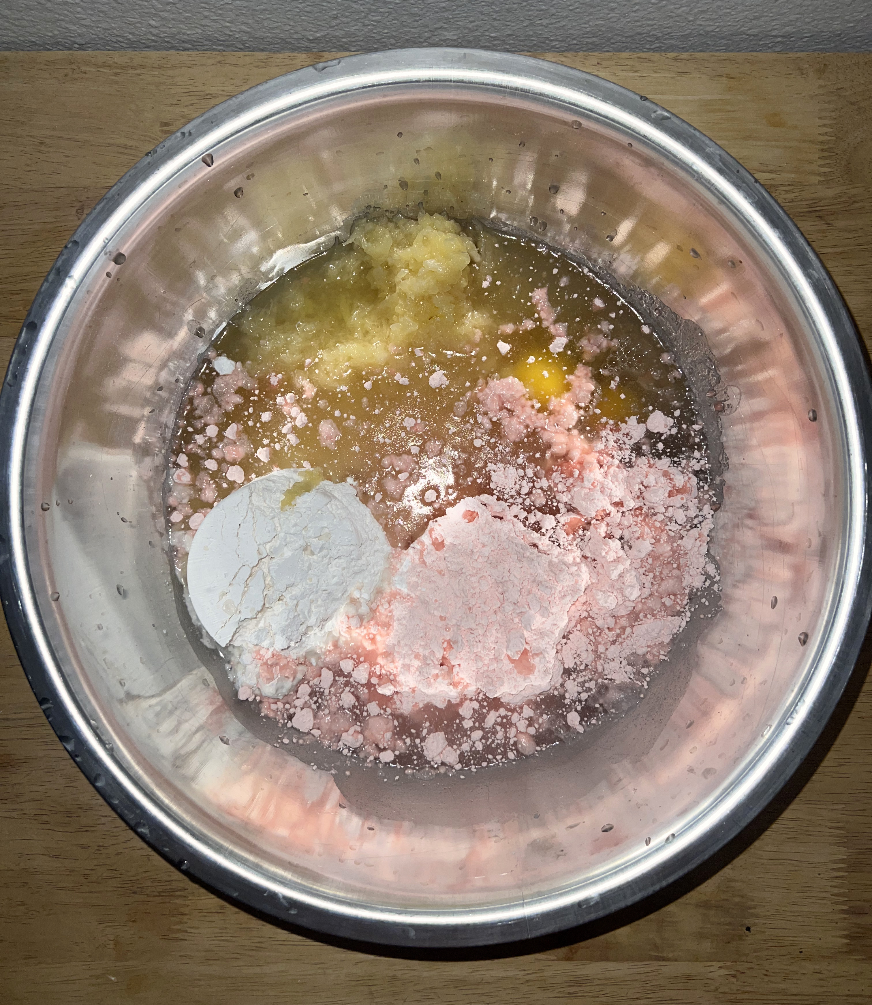 A picture of a bowl of all of the ingredients in the strawbery cake.