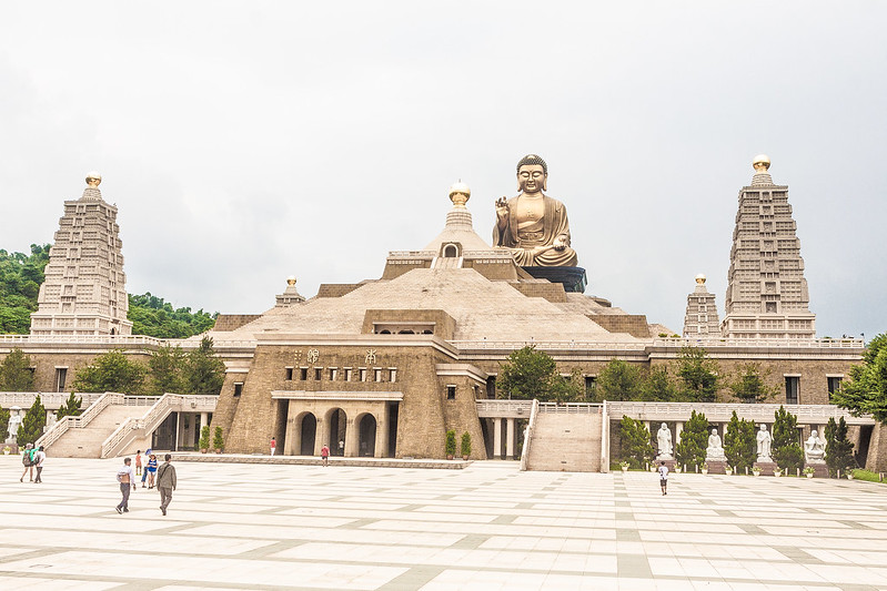 view of main building and metal Buddha statue