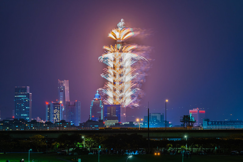 fireworks being shot off of Taipei 101 at night