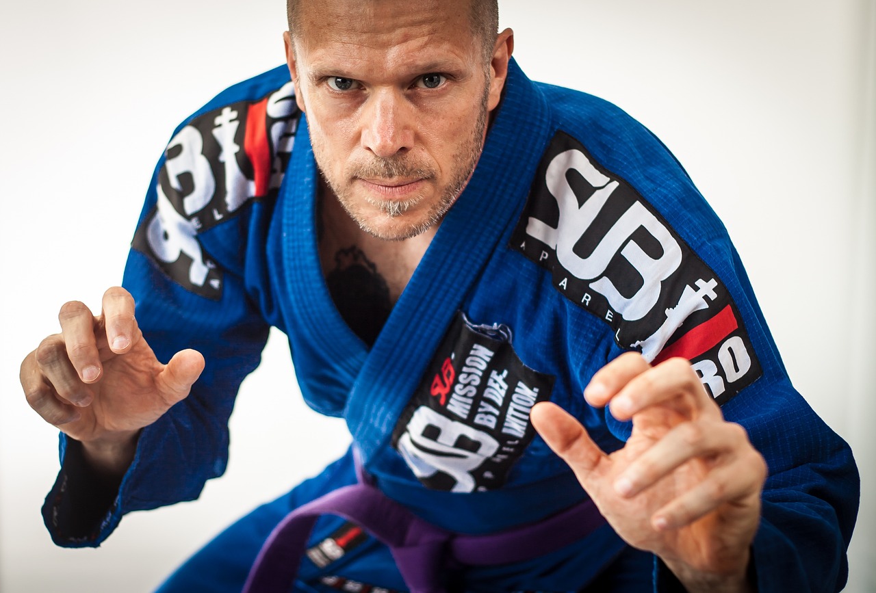 A purple belt looking straight into the camera, ready to shoot.