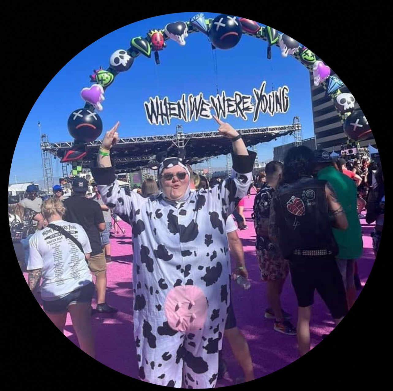 picture of katie in a cow costume at a concert