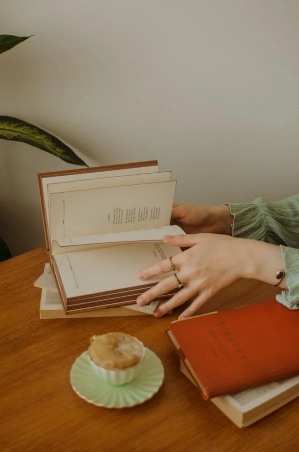 Someone flipping through a poetry book.