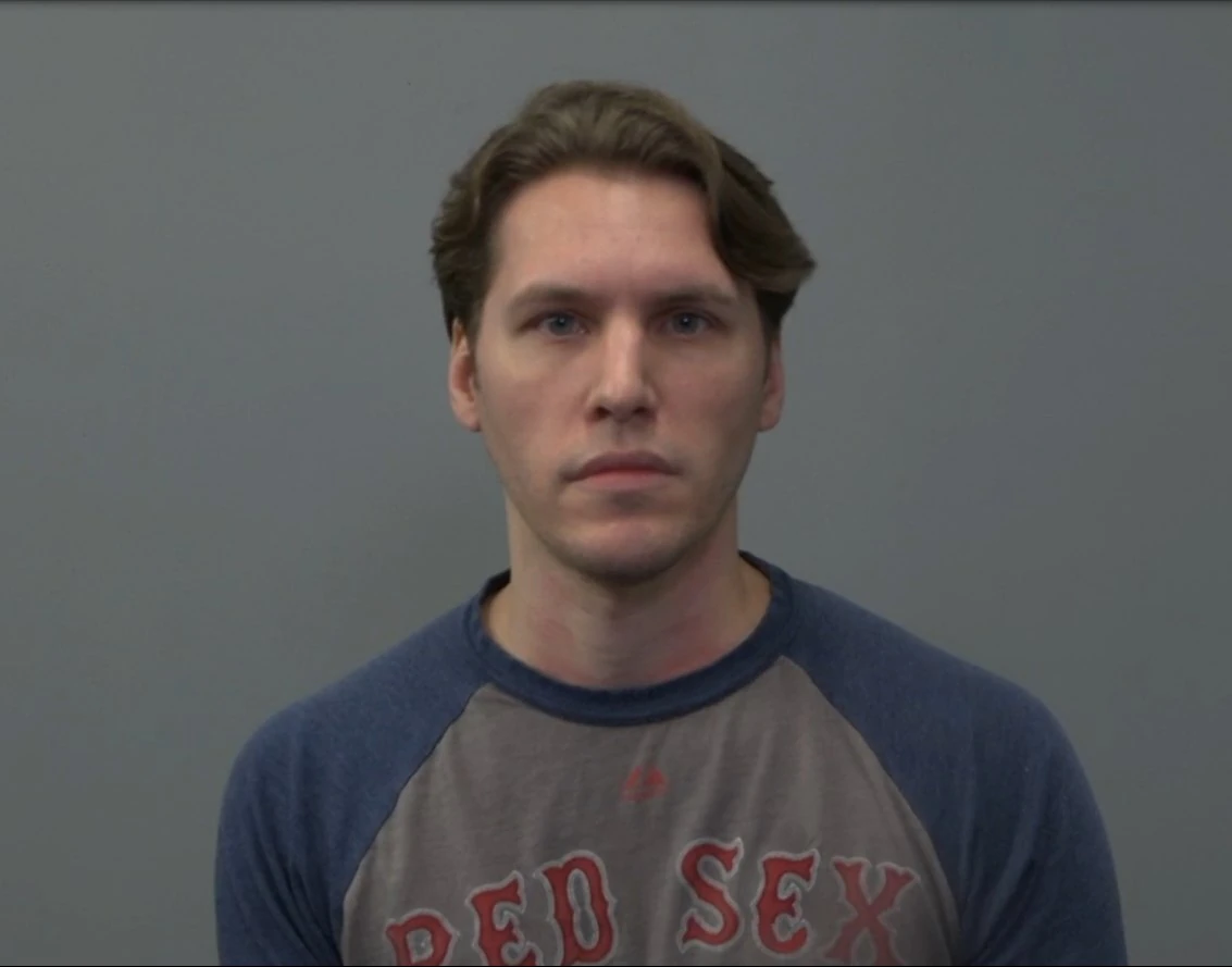 an image of Jerma985 in a similar manner of a mugshot